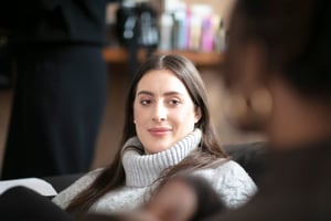 woman with brown hair looking candidly