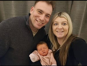 Care Fertility patients Natalie and Alex with their daughter Ava, who was born after using IVF. 