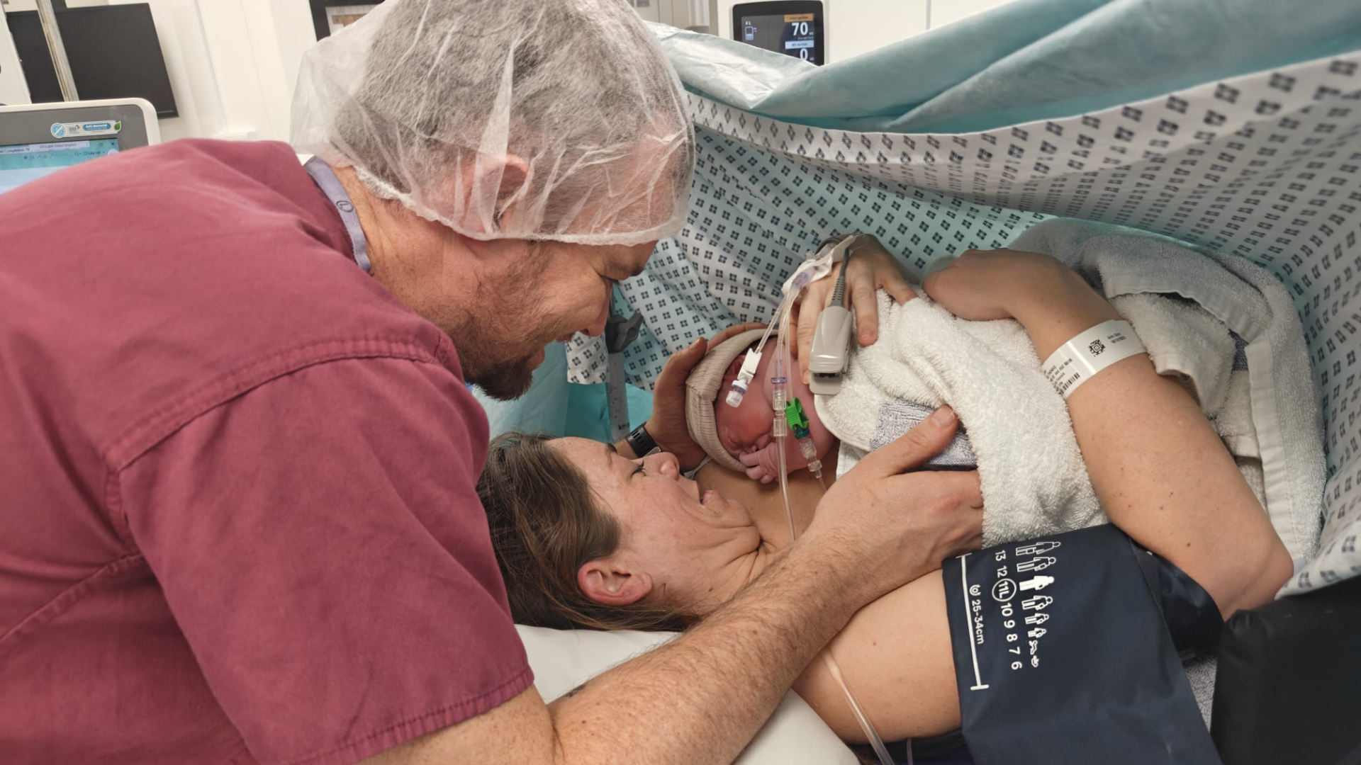 Laura and Sam meeting their baby girl Cleo after birth in hospital.