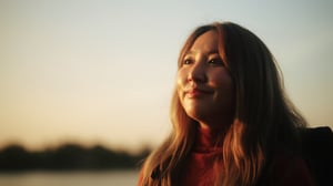 Asian woman with sunset