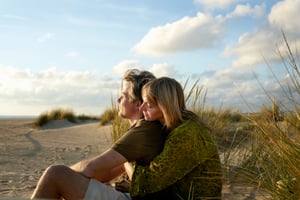 A couple embracing on the beach