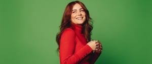 Red headed woman green background